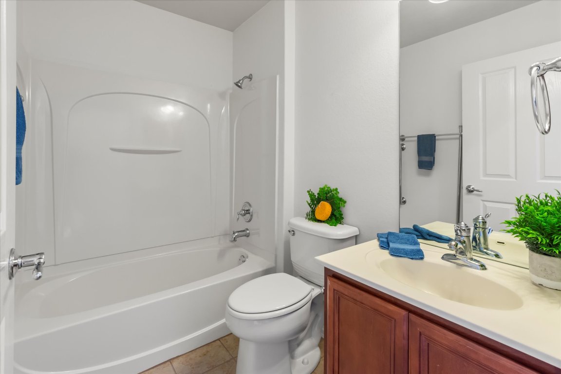 325 Barrington Farm Court Georgetown, TX 78633 - Photo 16 of 40 a bathroom with a sink toilet and shower