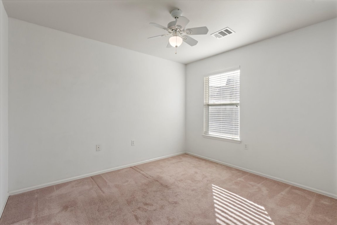 325 Barrington Farm Court Georgetown, TX 78633 - Photo 17 of 40 an empty room with a window and a fan