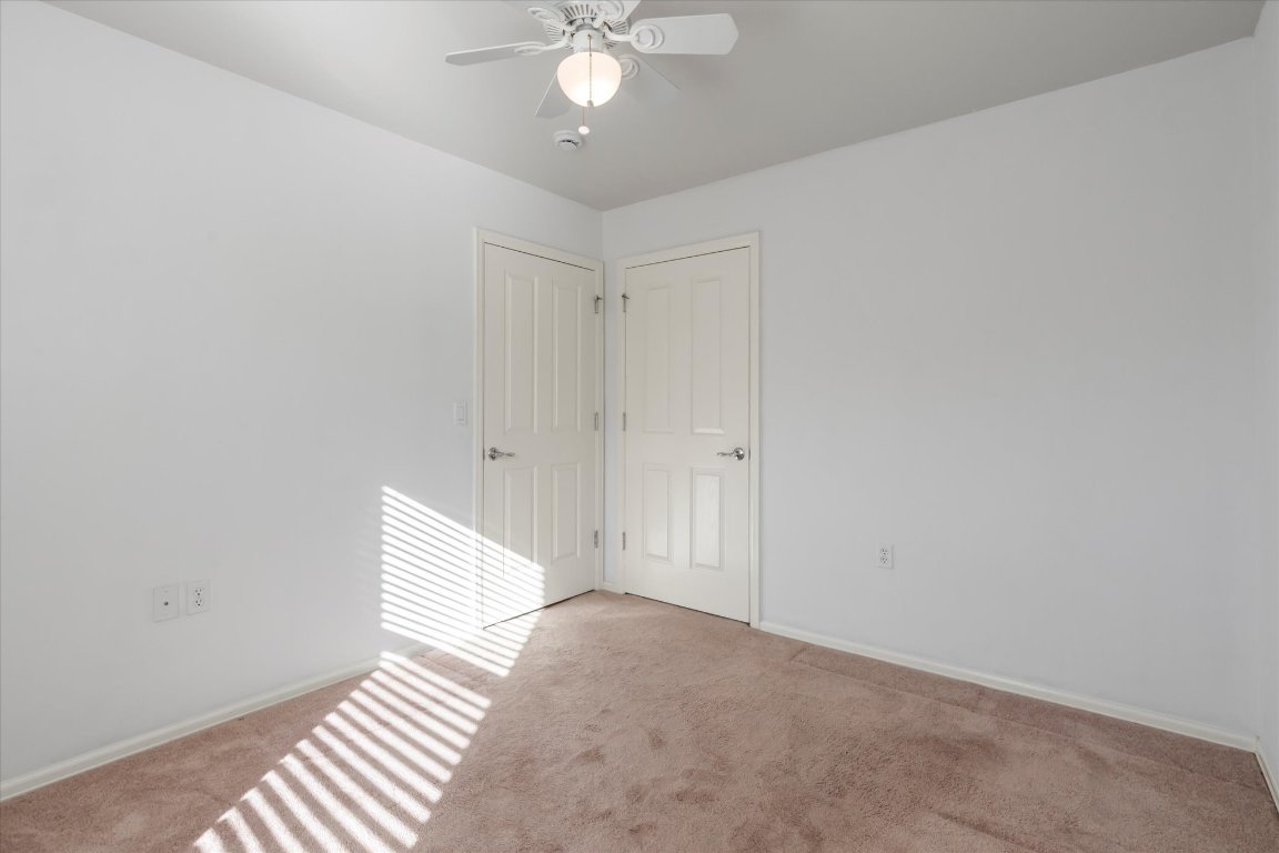 325 Barrington Farm Court Georgetown, TX 78633 - Photo 19 of 40 a view of a room with wooden floor and fan