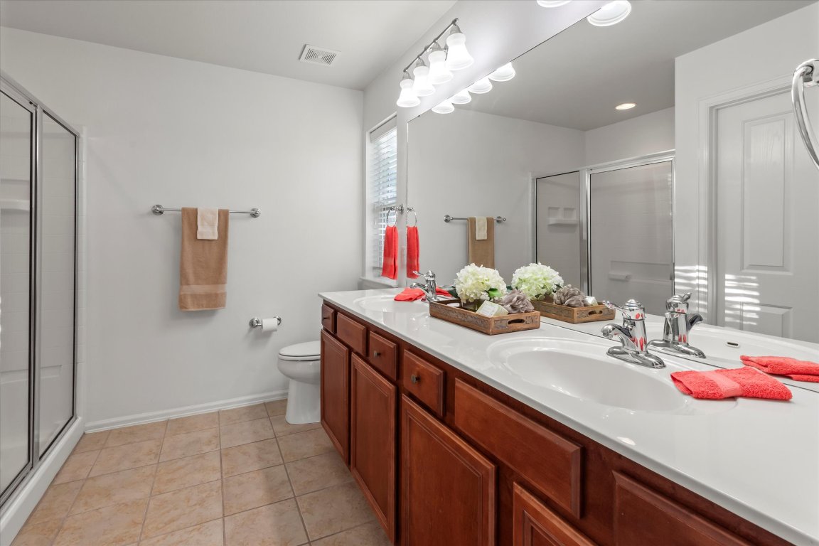 325 Barrington Farm Court Georgetown, TX 78633 - Photo 23 of 40 a bathroom with a sink and a mirror