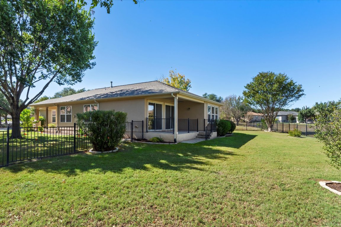 325 Barrington Farm Court Georgetown, TX 78633 - Photo 28 of 40 a view of a house with a yard and large tree