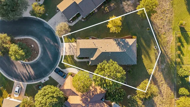 an aerial view of residential house with outdoor space and swimming pool