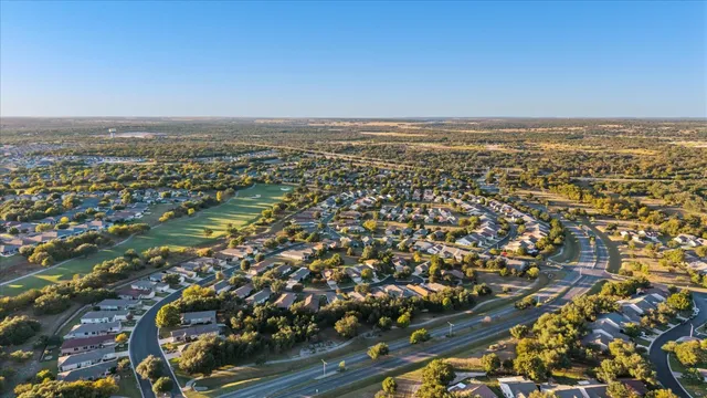 an aerial view of a city with lake view