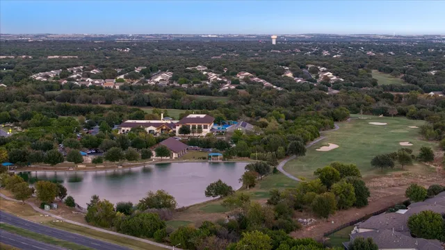 an aerial view of city and lake