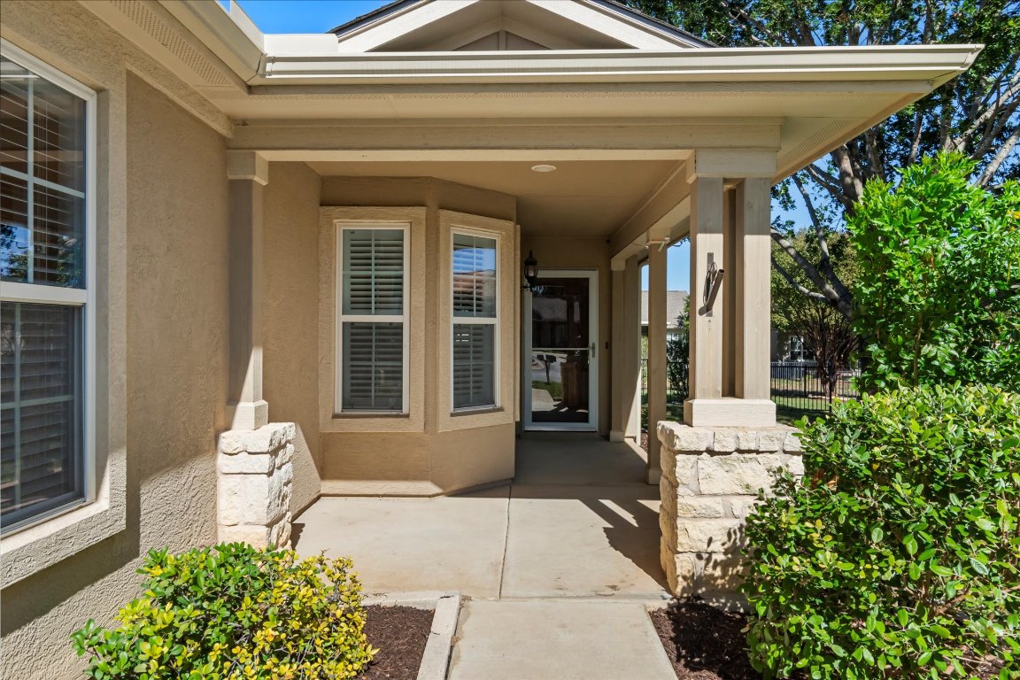 325 Barrington Farm Court Georgetown, TX 78633 - Photo 4 of 40 a front view of a house with garden