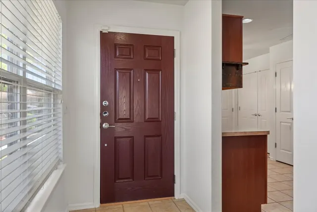 a kitchen with a sink stove top oven and cabinets