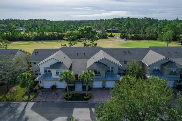 an aerial view of a house with outdoor space swimming pool and lake view