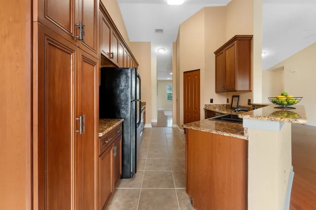 a kitchen with stainless steel appliances a refrigerator and a stove