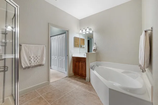 a bathroom with a bathtub and a shower