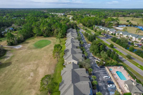 a view of a yard with potted plants