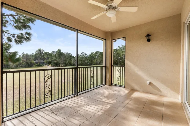 a view of a balcony with a ceiling fan