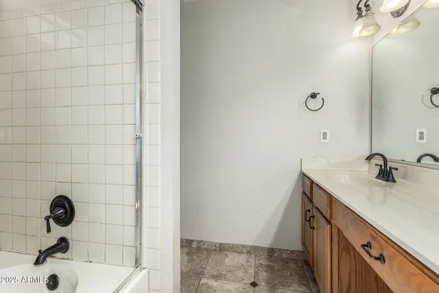a bathroom with a sink a vanity and a mirror