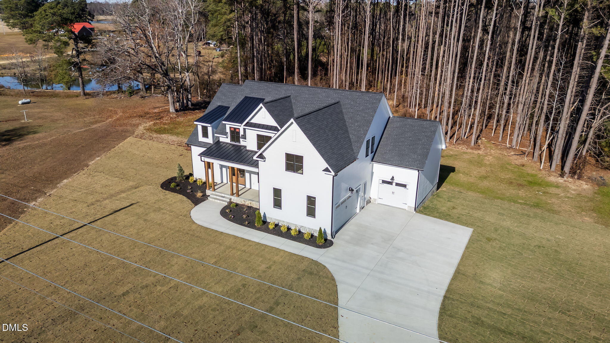 2590 Lassiter Road Four Oaks, NC 27524 - Photo 61 of 72 a view of a house with backyard and sitting area