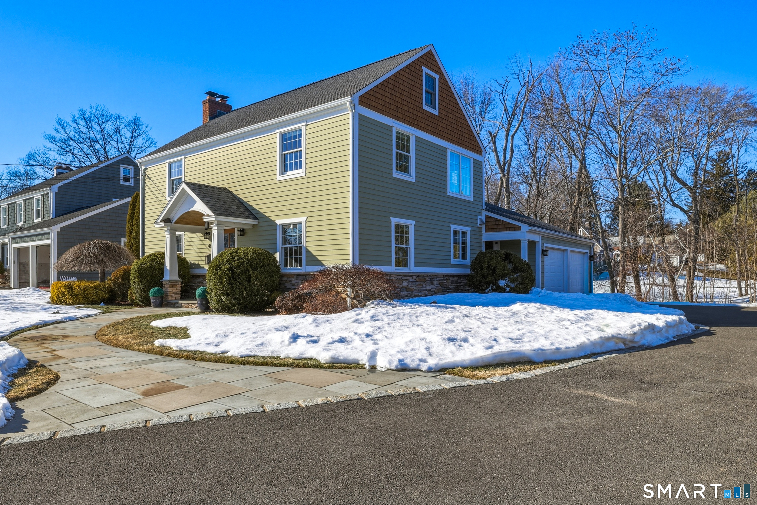 4 Wyndwood Road West Hartford, CT 06107 - Photo 1 of 1 a view of a house with snow on the road
