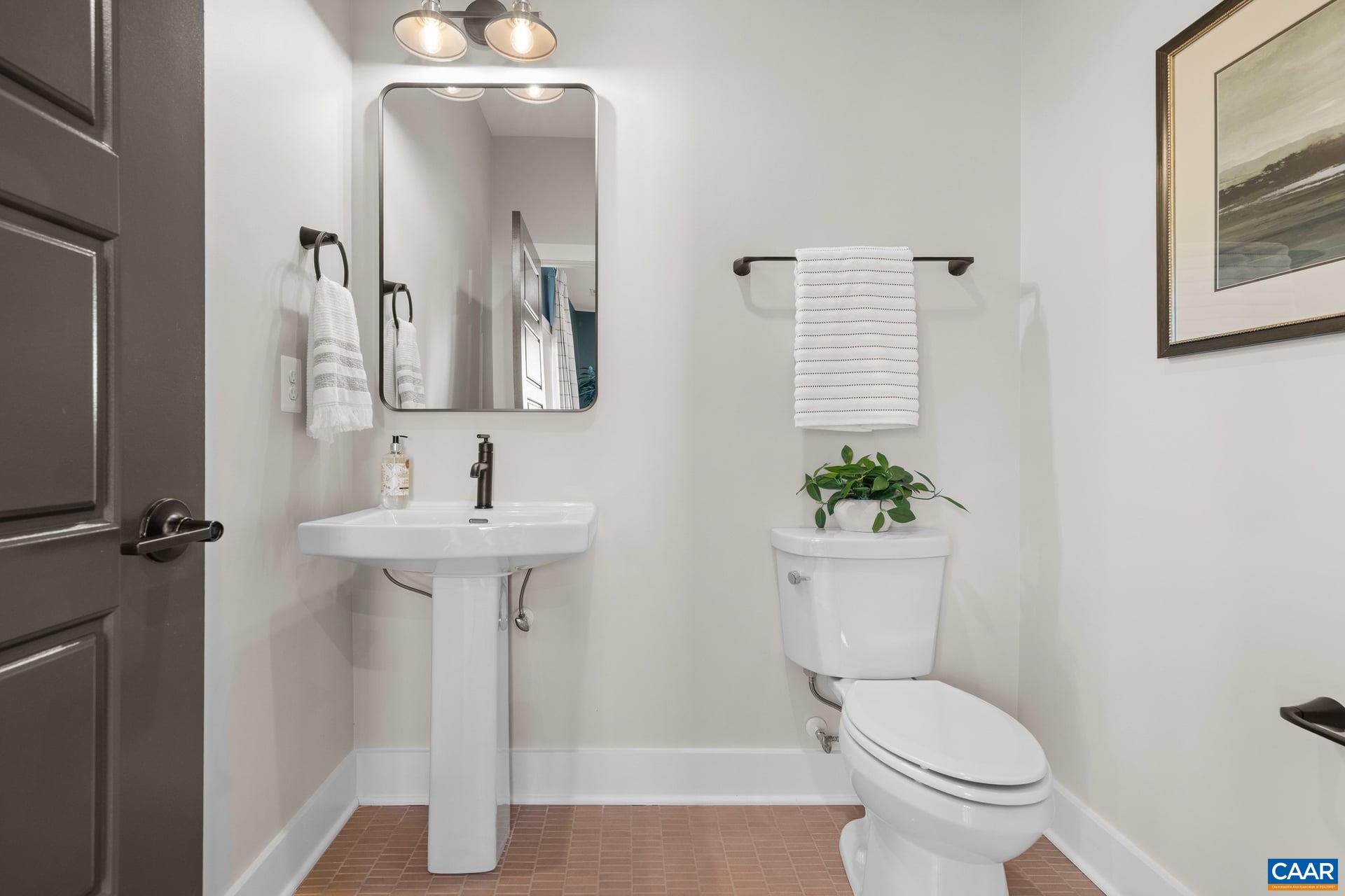 48 B Miranda Crossing Charlottesville, VA 22901 - Photo 11 of 28 a bathroom with a toilet sink and mirror
