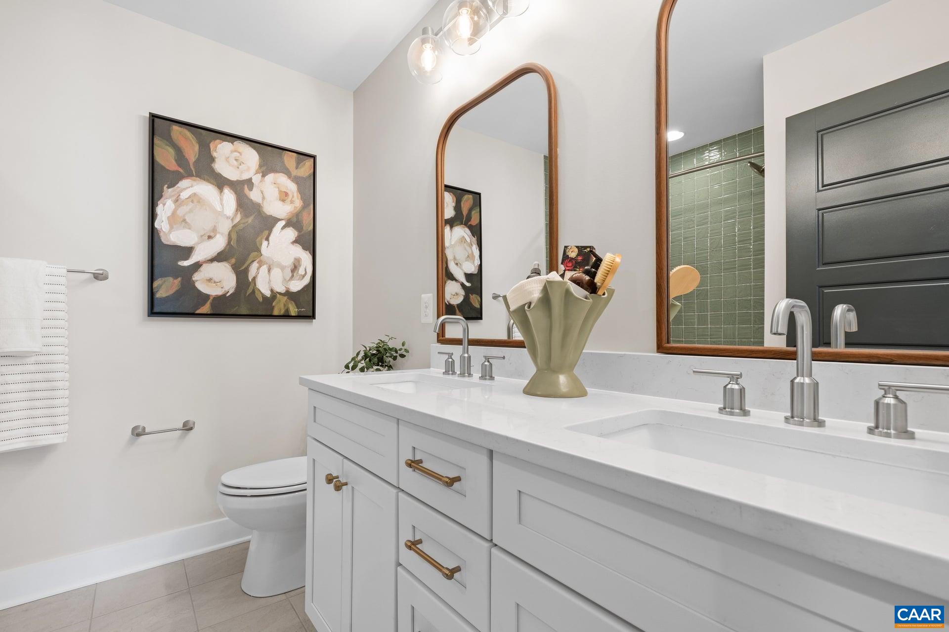 48 B Miranda Crossing Charlottesville, VA 22901 - Photo 19 of 28 a bathroom with a toilet sink and mirror