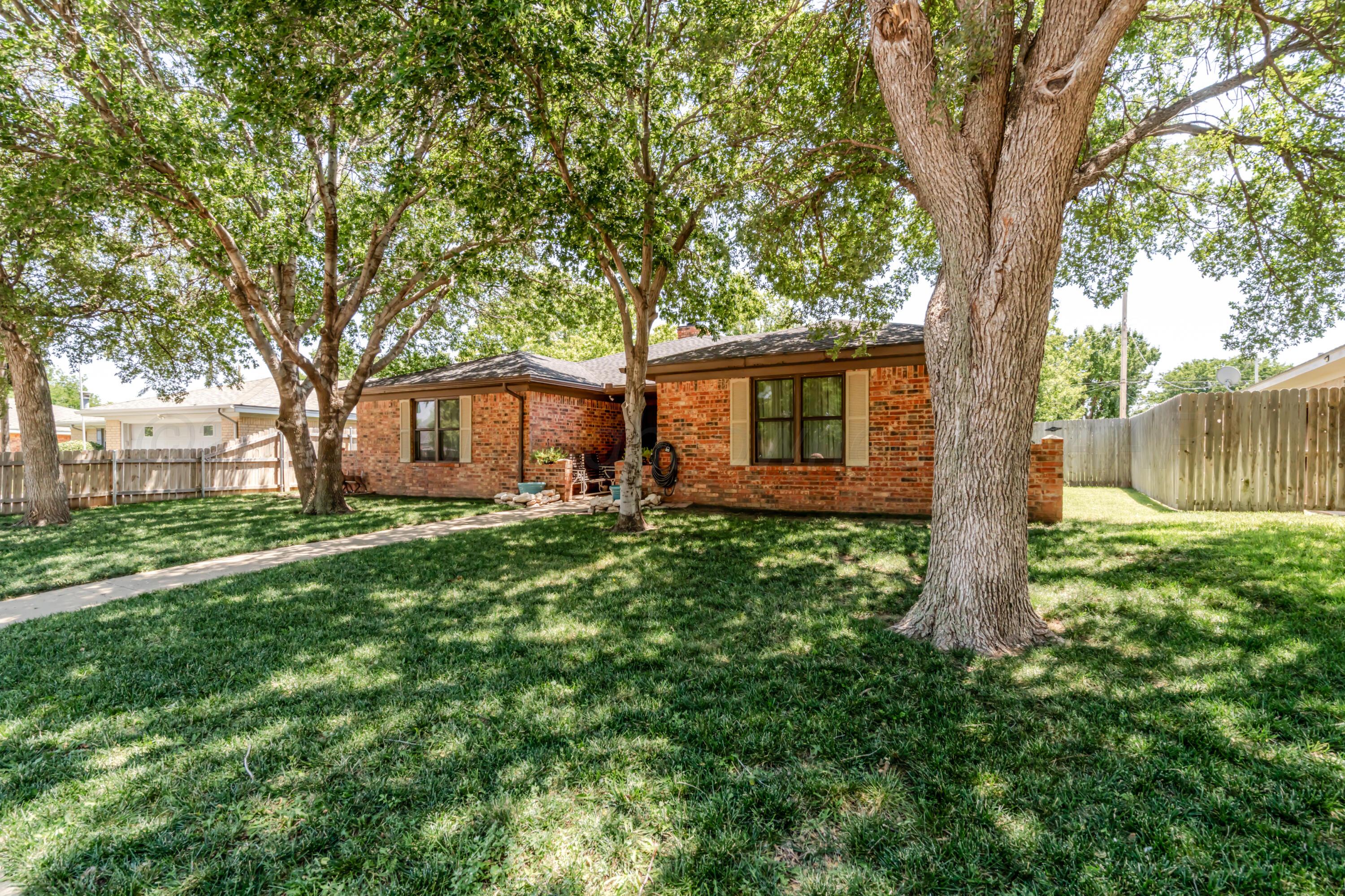 7909 Gerald Drive Amarillo, TX 79121 - Photo 1 of 26 a front view of a house with garden