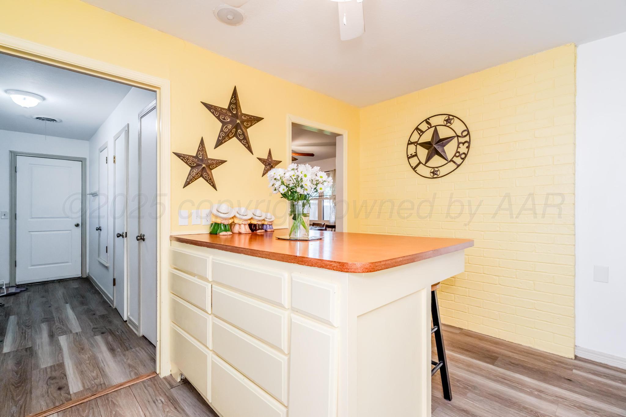 7909 Gerald Drive Amarillo, TX 79121 - Photo 14 of 26 workspace with wooden floor