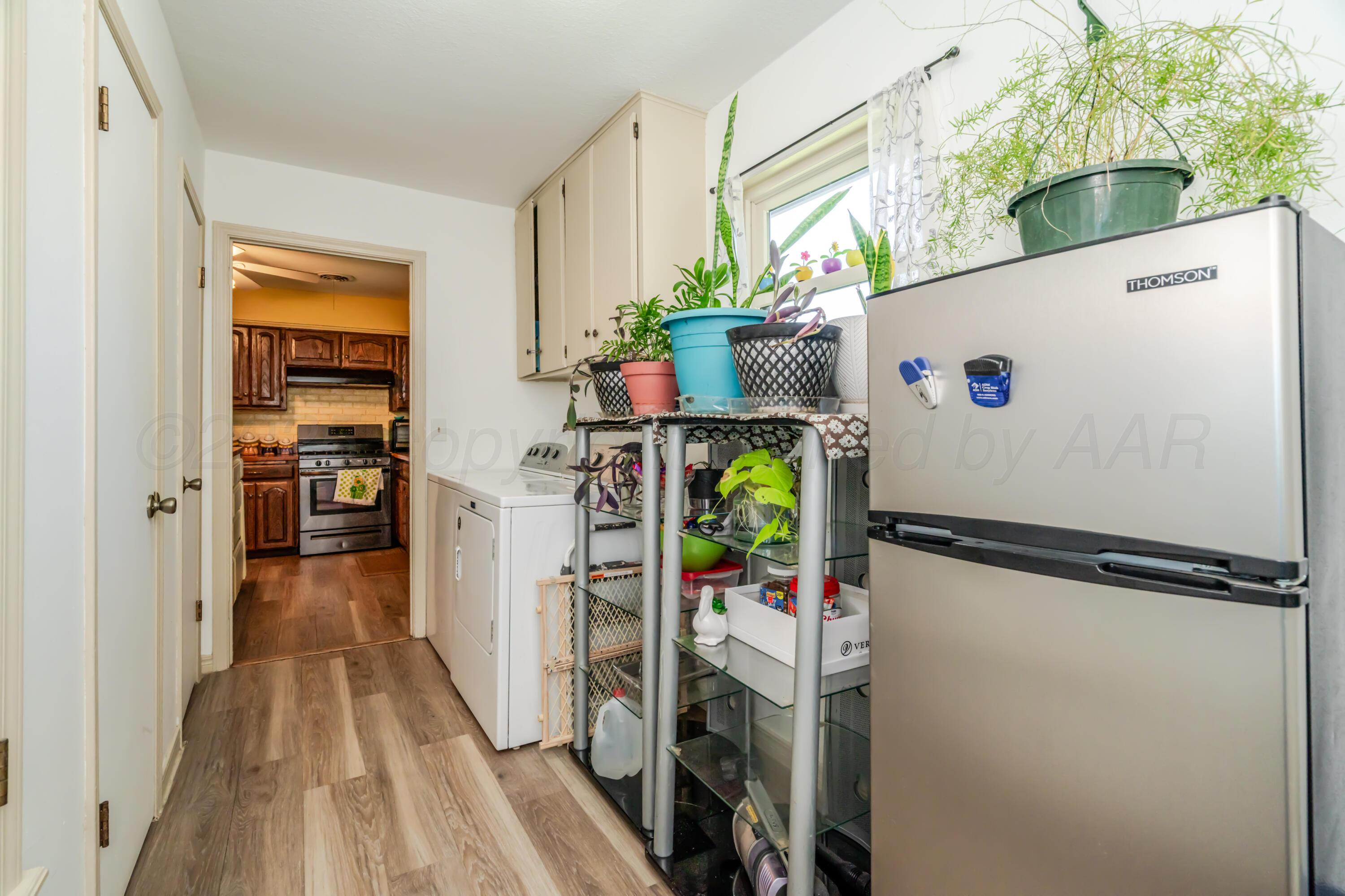 7909 Gerald Drive Amarillo, TX 79121 - Photo 16 of 26 a view of walk in closet with clothes and shoes