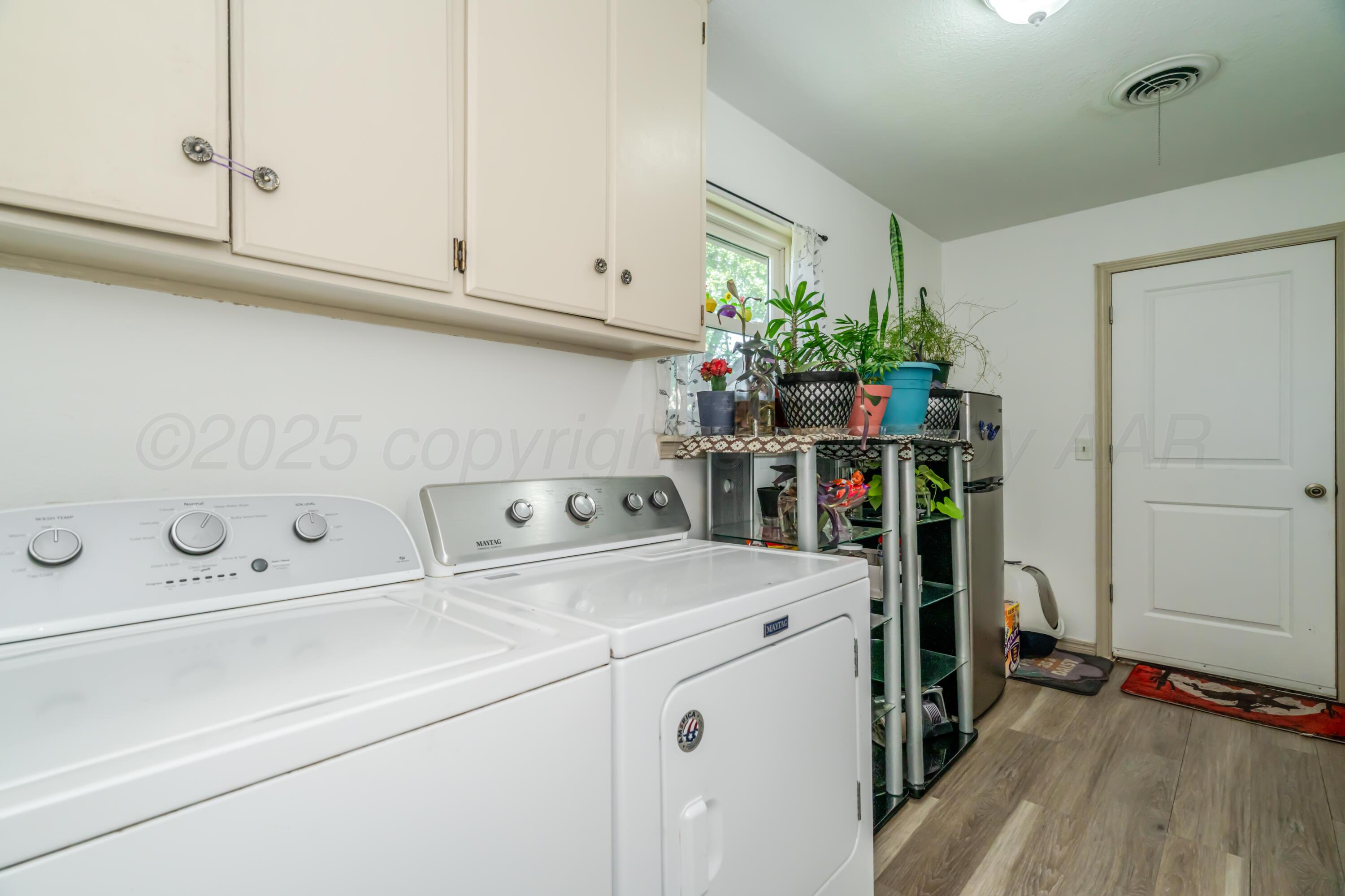 7909 Gerald Drive Amarillo, TX 79121 - Photo 17 of 26 a utility room with dryer and washer