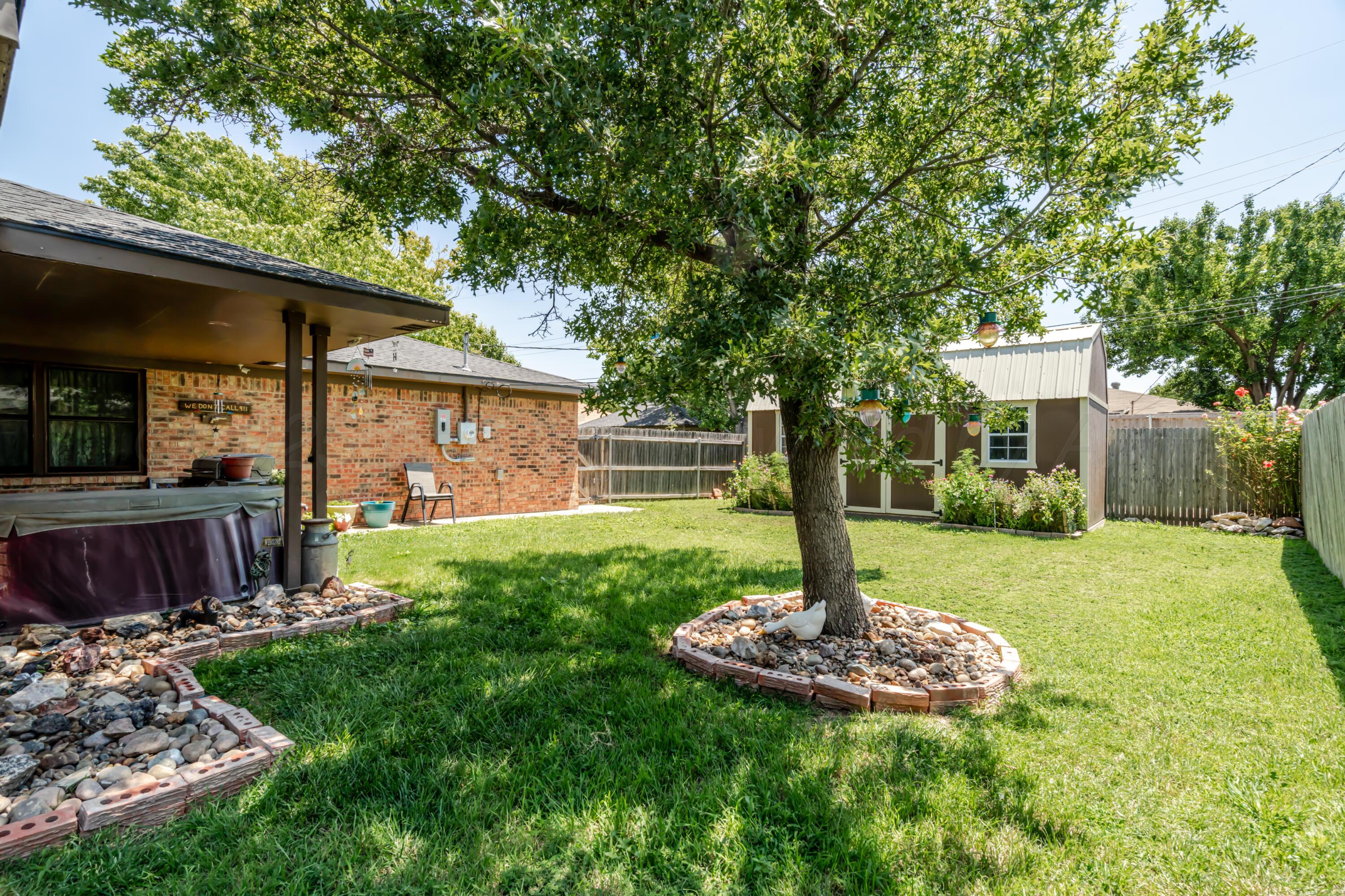 7909 Gerald Drive Amarillo, TX 79121 - Photo 23 of 26 a front view of a house with a yard balcony and outdoor seating