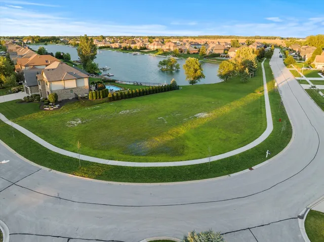 a view of a swimming pool with an outdoor seating