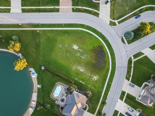a view of swimming pool from a balcony