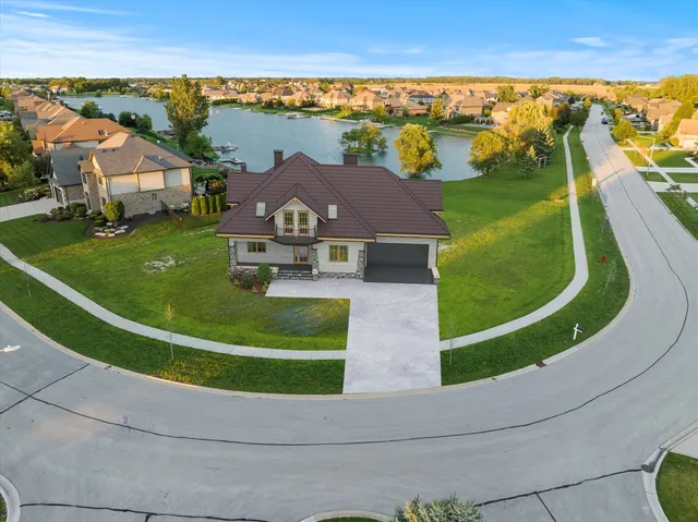 an aerial view of a house with a swimming pool