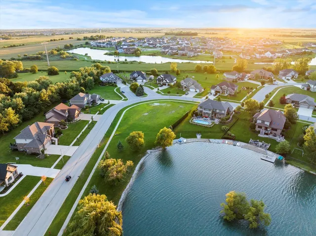 an aerial view of residential houses with outdoor space