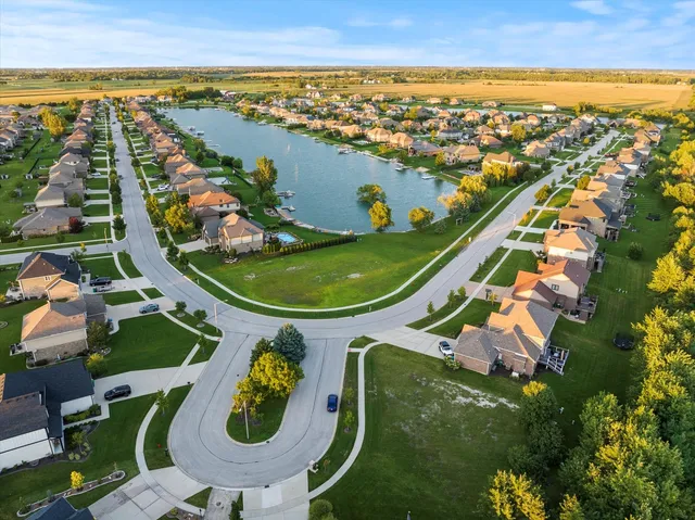 an aerial view of a house with swimming pool and ocean view