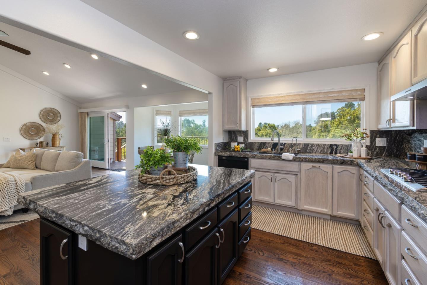 573 Meadow Road Aptos, CA 95003 - Photo 12 of 53 a kitchen with granite countertop kitchen island stainless steel appliances a sink and stove