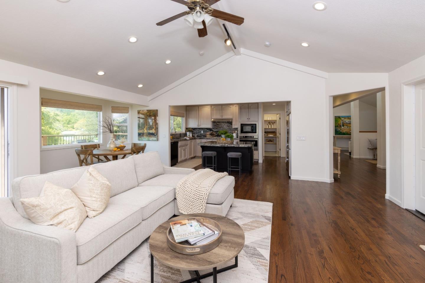 573 Meadow Road Aptos, CA 95003 - Photo 23 of 53 a living room with furniture kitchen view and a wooden floor