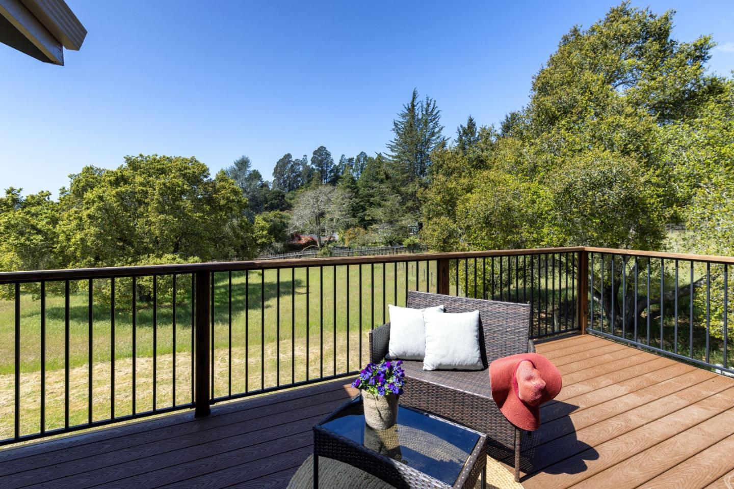 573 Meadow Road Aptos, CA 95003 - Photo 30 of 53 a balcony with wooden floor table and chairs