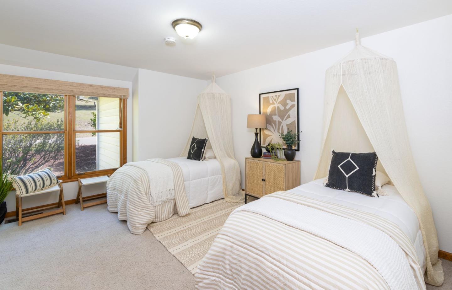 573 Meadow Road Aptos, CA 95003 - Photo 35 of 53 a bedroom with bed and a large window