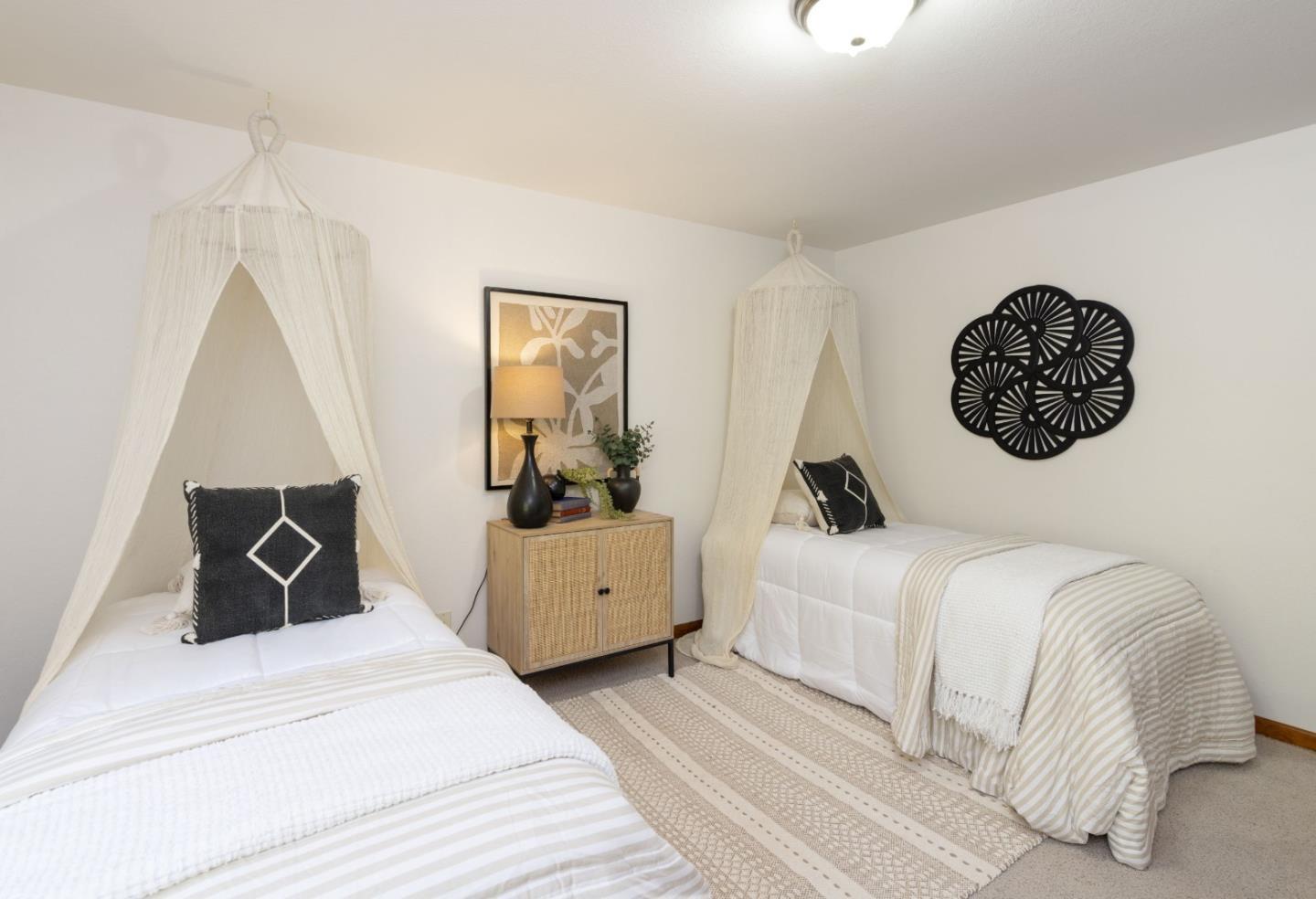 573 Meadow Road Aptos, CA 95003 - Photo 36 of 53 a bedroom with a bed and a large mirror