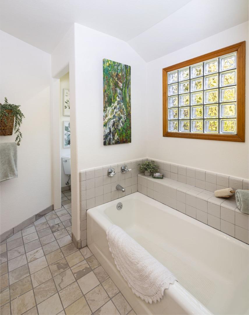 573 Meadow Road Aptos, CA 95003 - Photo 39 of 53 a spacious bathroom with bathtub and window