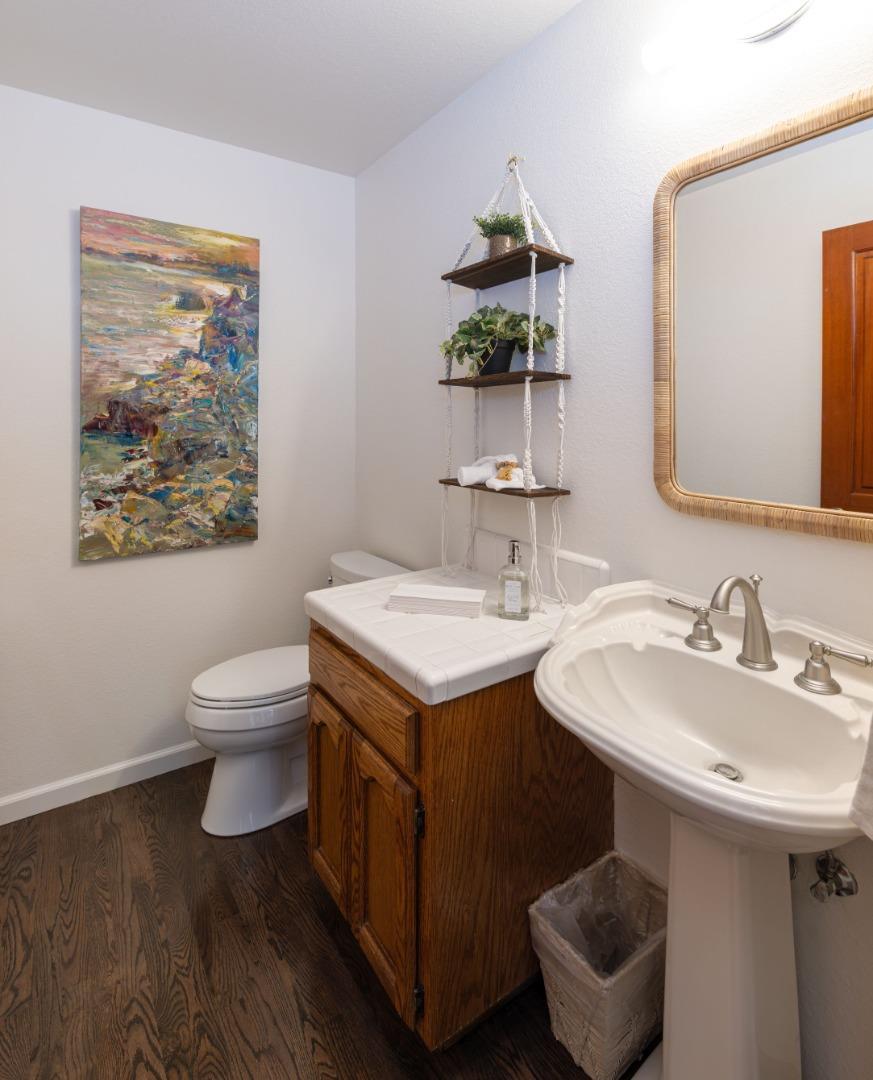 573 Meadow Road Aptos, CA 95003 - Photo 45 of 53 a bathroom with a toilet sink and mirror