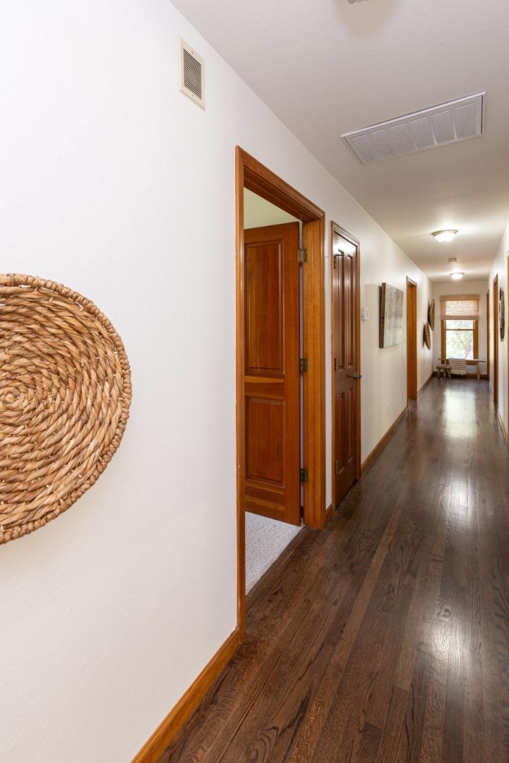 573 Meadow Road Aptos, CA 95003 - Photo 46 of 53 a view of a hallway with wooden floor