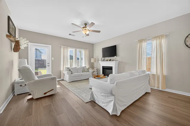 a bedroom with a bed and a tv on the dresser