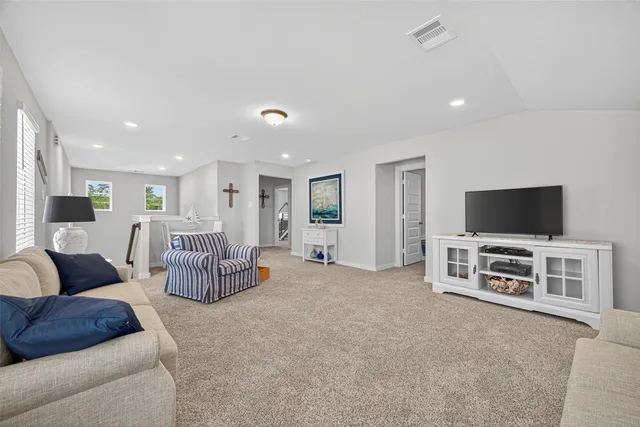 a white bath tub sitting next to a white toilet