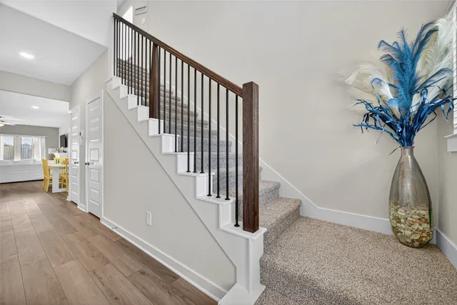 a kitchen with stainless steel appliances granite countertop a stove a sink dishwasher and a refrigerator