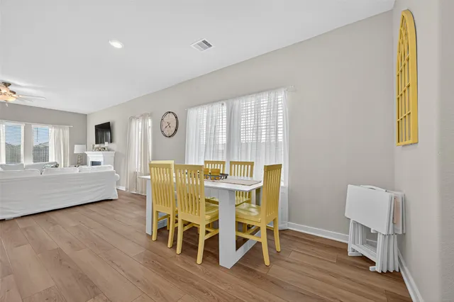 a kitchen with stainless steel appliances granite countertop a sink stove and wooden floor