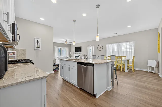 a living room with furniture fireplace and a flat screen tv