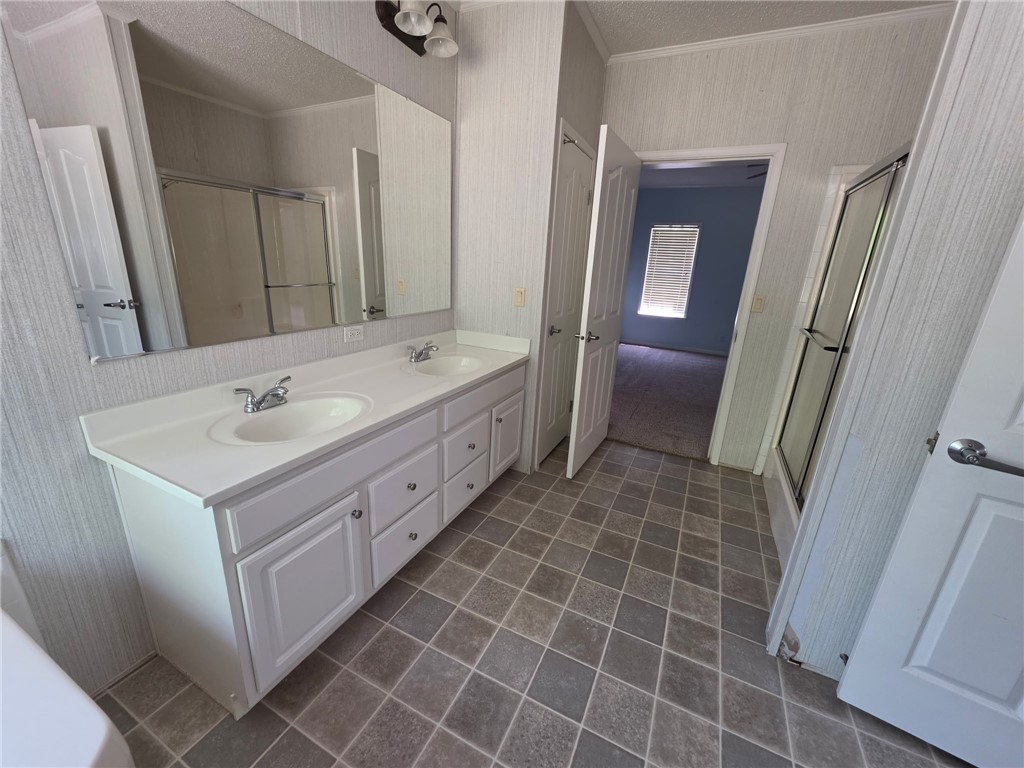 1400 Massey Road Pendleton, SC 29670 - Photo 14 of 25 This bathroom features a double vanity and sleek tiled flooring.