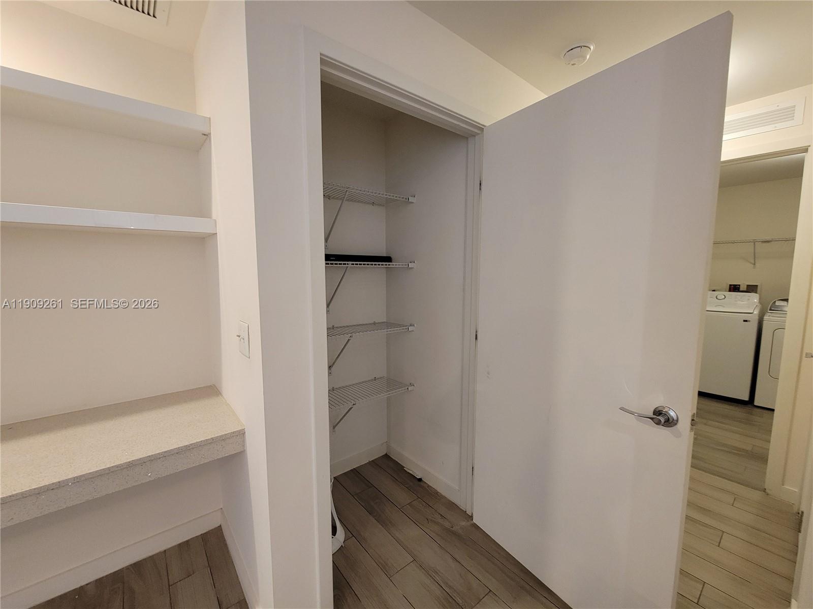 999 Southwest 1st Avenue, Unit 2016 Miami, FL 33130 - Photo 13 of 49 a view of walk in closet