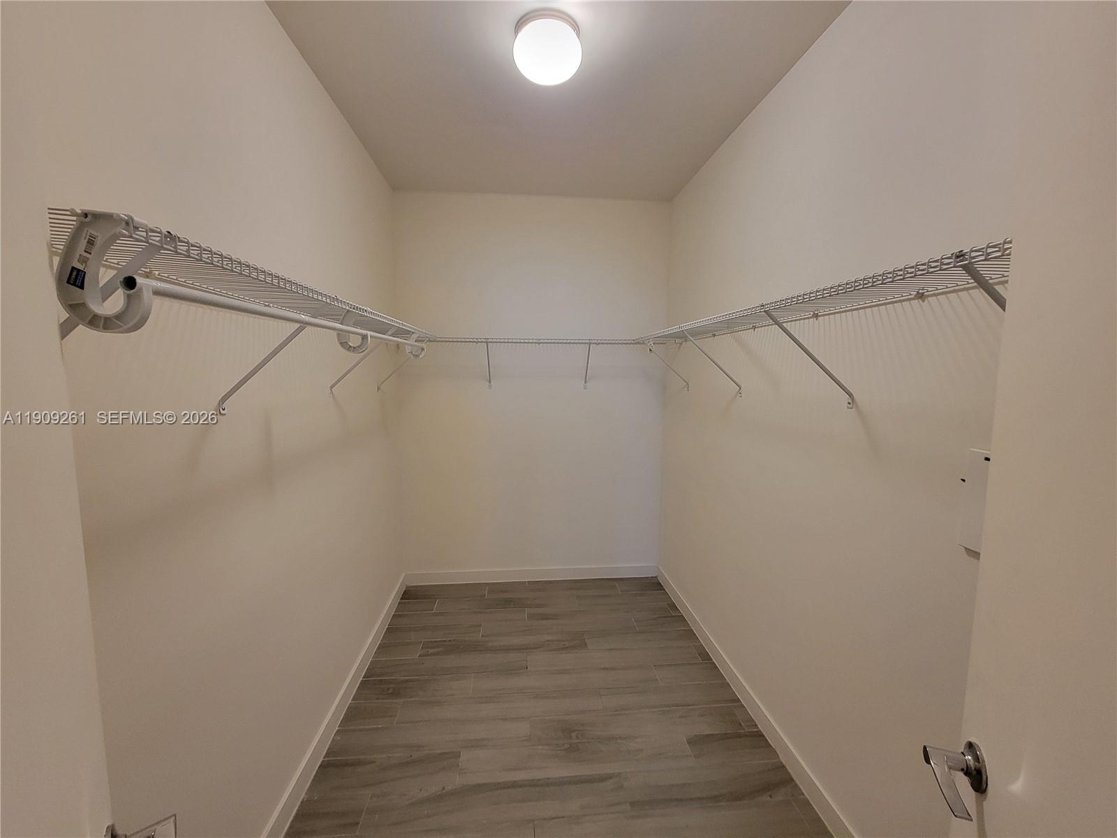 999 Southwest 1st Avenue, Unit 2016 Miami, FL 33130 - Photo 27 of 49 a view of a room with wooden floor