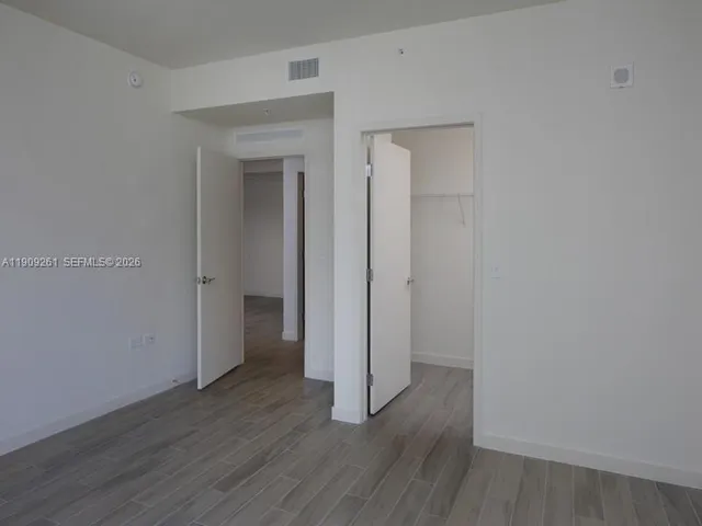 a view of a balcony with wooden floor