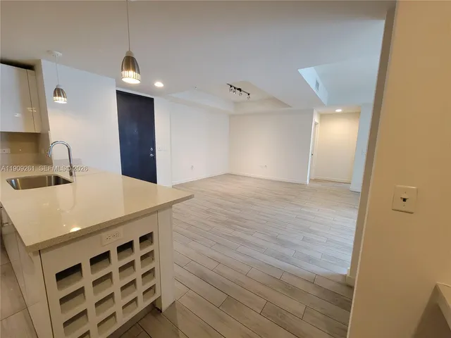 a room with a couch and a dresser in it