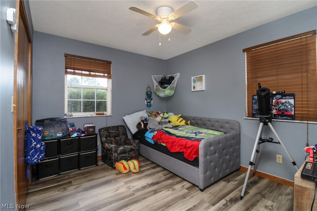 25 Lane Road Vincent, OH 45784 - Photo 16 of 40 Bedroom with wood-type flooring and ceiling fan