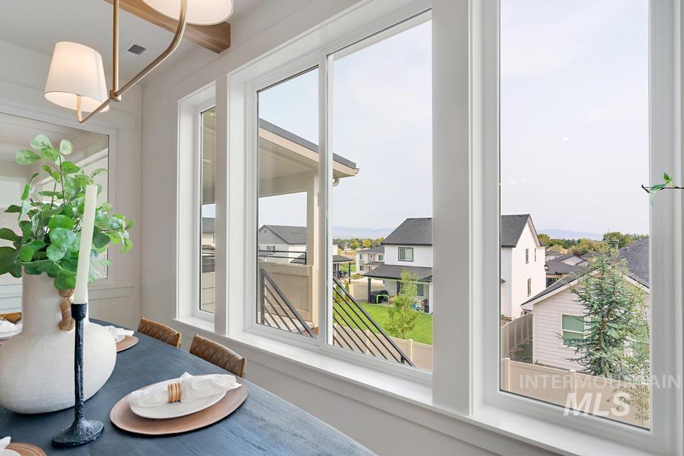 3322 South Volunteer Place Meridian, ID 83642 - Photo 29 of 50 Sunroom / solarium featuring healthy amount of natural light and a residential view